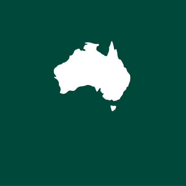 White silhouette of Australia Made & Owned on a green background